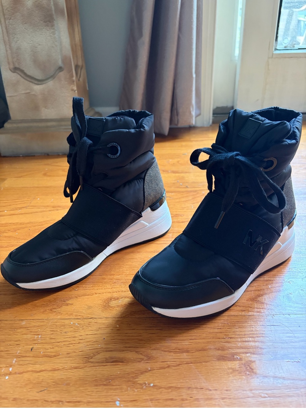 Michael Kors Black and White Puffer Wedge Sneakers
